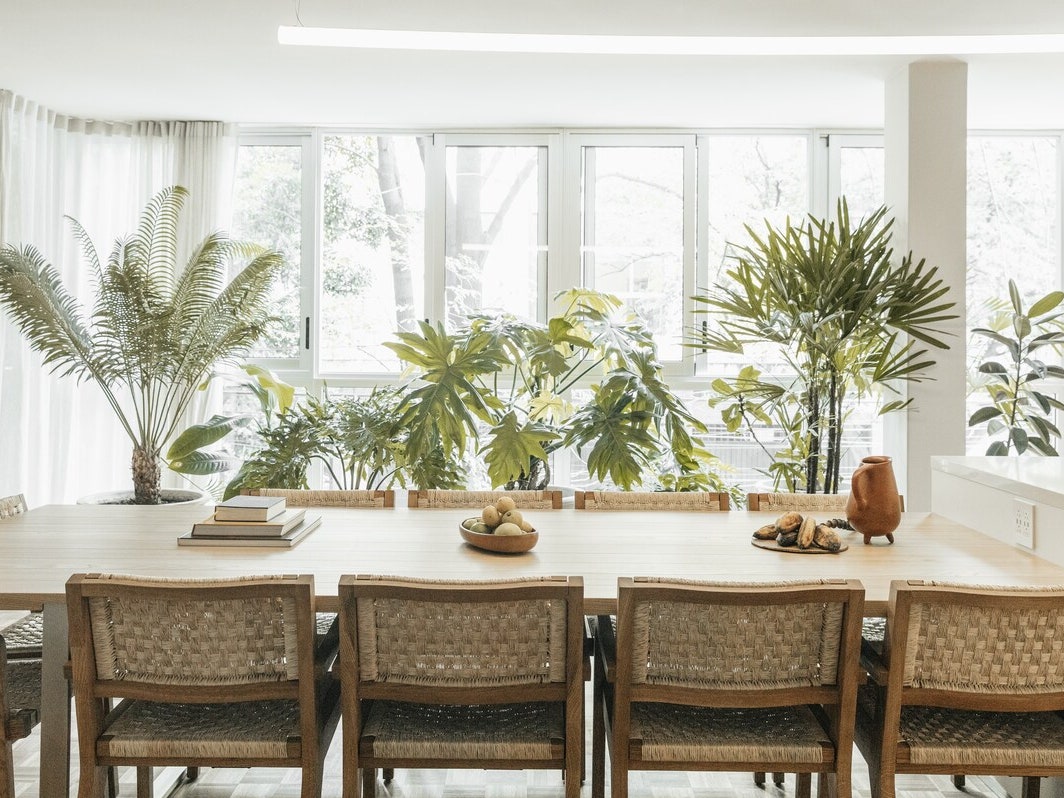 a mexico city airbnb with a large dining room with woven chairs